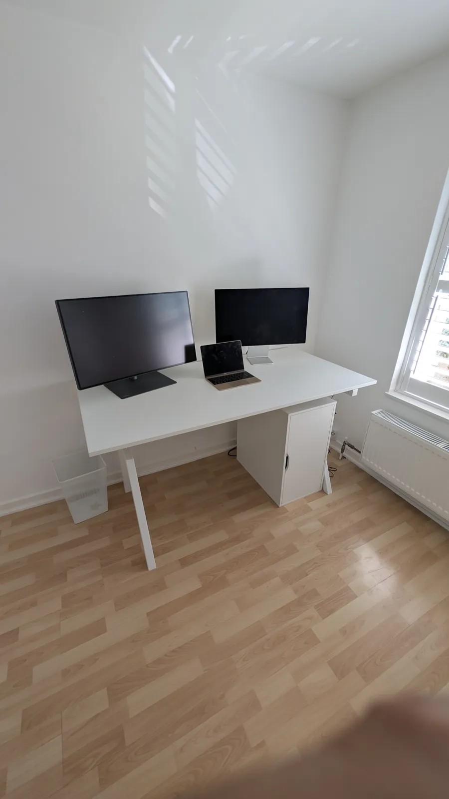 White desk assembled with dual monitor setup