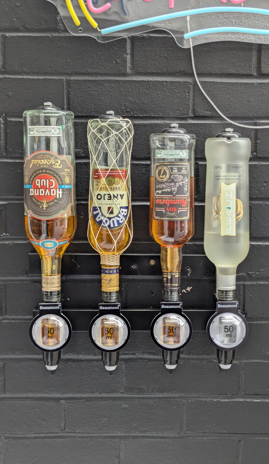 Wall-mounted spirit optic dispensers fitted