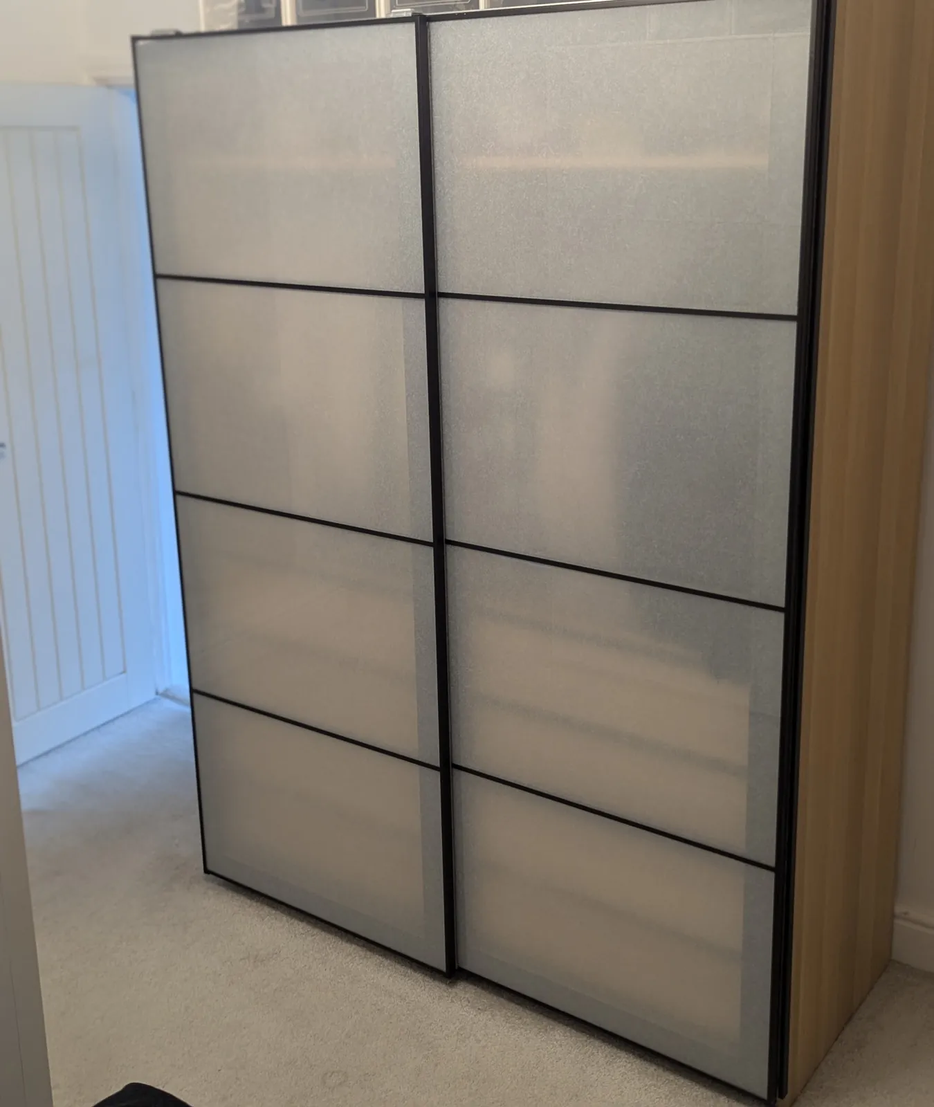 Frosted sliding-door wardrobe assembled