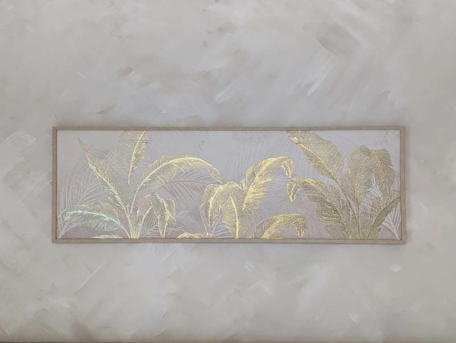 Wide botanical canvas hung on a textured wall